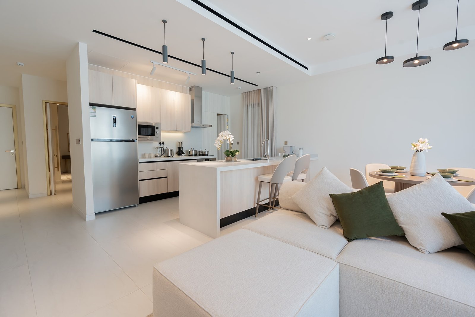 Modern open-plan kitchen and living area with stylish furniture at Marissa Elite.